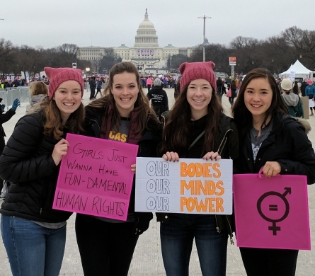 Picture of young women standing with signs in Washington D.C.